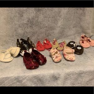 8 pairs of newborn shoes